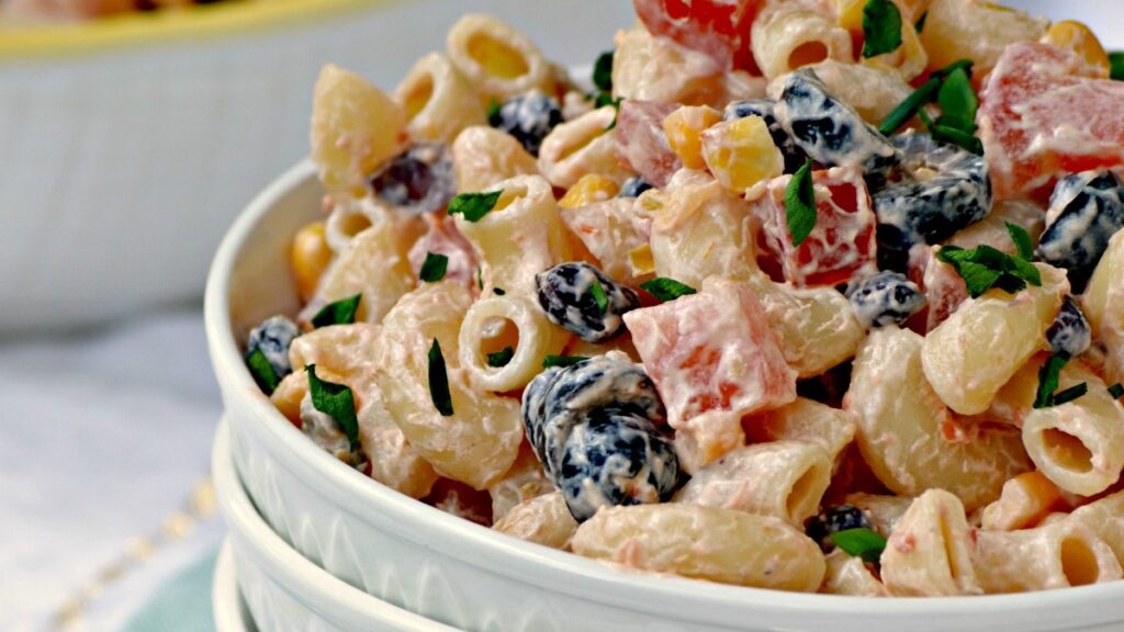 This Mexican Macaroni Salad recipe is a very versatile summer salad perfect for picnics and barbecues as as a tasty side dish.