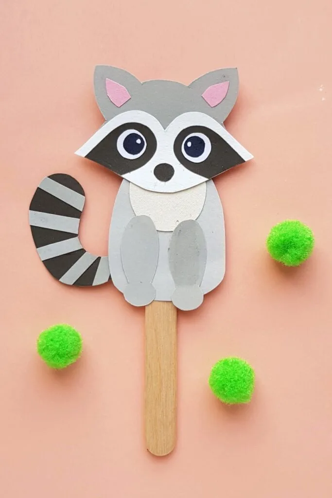 This Papercraft Raccoon Puppet is an easy kids paperfcraft animal project with a free papercraft template to help you make this kids craft.