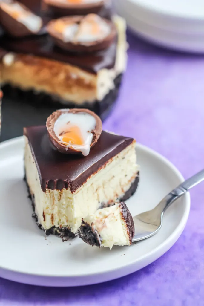 This Instant Pot Creme Egg Cheesecake is an easy Easter dessert; rich vanilla cheesecake smothered in chocolate ganache & SO MANY CREME EGGS!