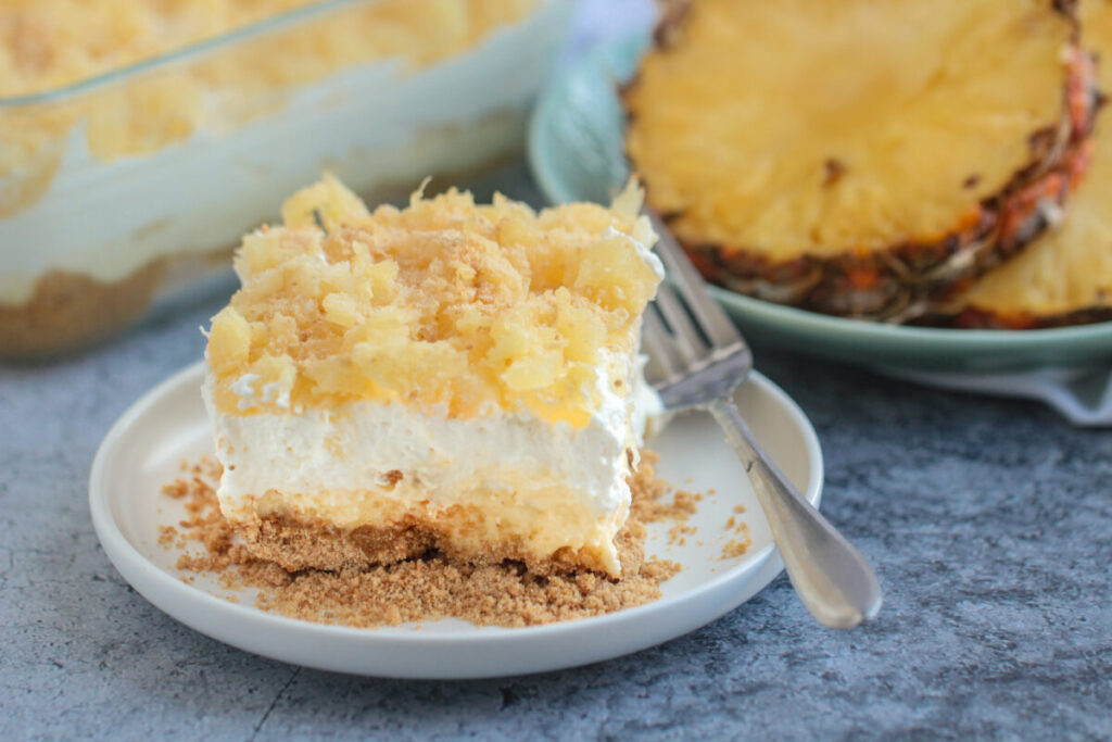 Pineapple delight is a rich and sweet no-bake dessert full of tangy pineapple, rich whipped cream and a buttery sweet filling.