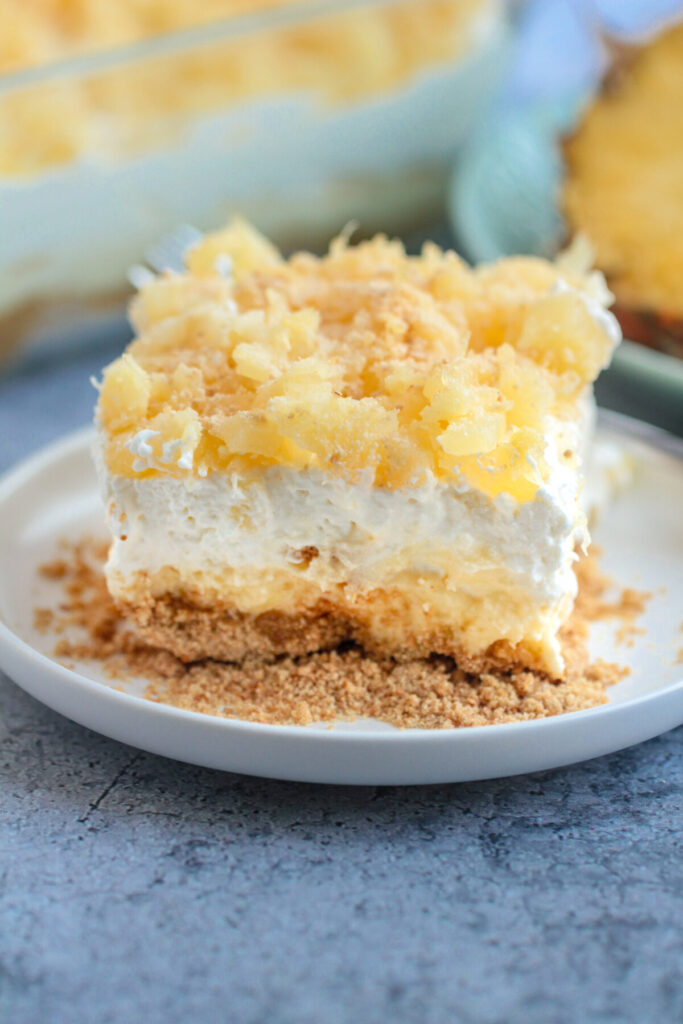 Pineapple delight is a rich and sweet no-bake dessert full of tangy pineapple, rich whipped cream and a buttery sweet filling.