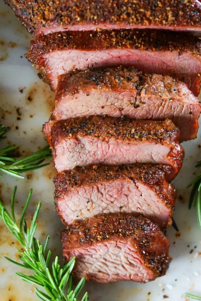 Smoked Tri-Tip is flavourful, juicy, and melt in your mouth tender. Make the best beef tip roast on any type of smoker with this easy recipe!