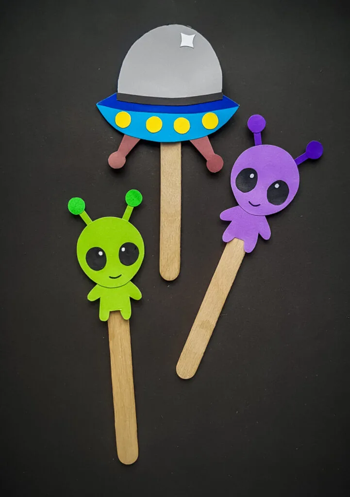 These Papercraft Alien Craft Stick Puppets are made easy with a free papercraft template to help you make this kids craft.