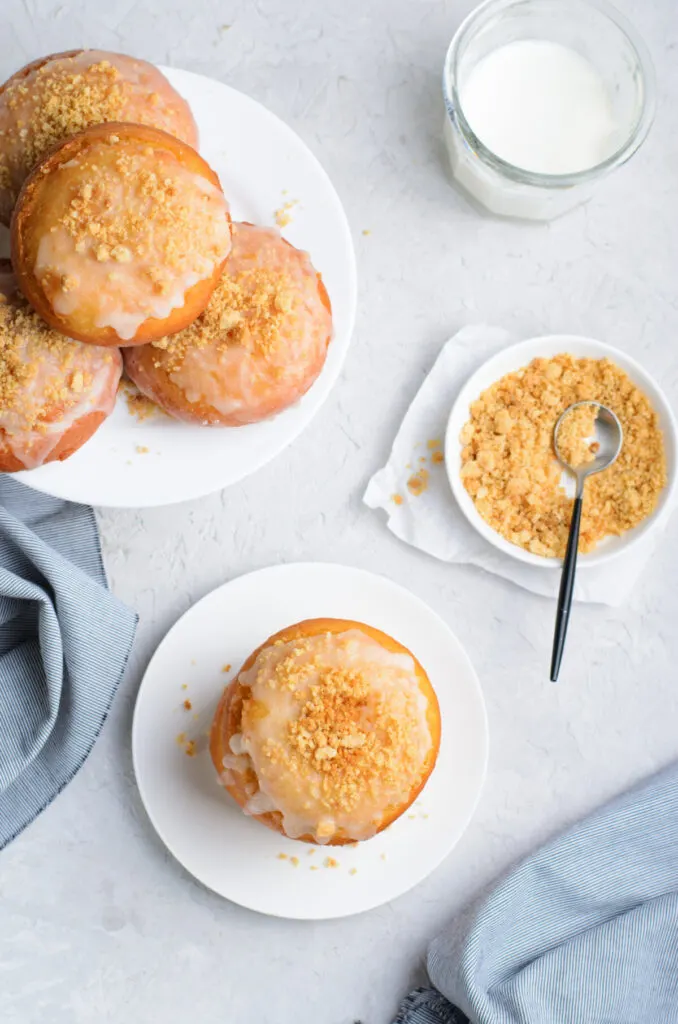 Dulce De Leche Donuts featuring a buttery tender dough that is stuffed with dulce de leche and fried up into a golden, fluffy masterpiece.