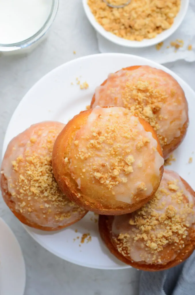 Dulce De Leche Donuts featuring a buttery tender dough that is stuffed with dulce de leche and fried up into a golden, fluffy masterpiece.
