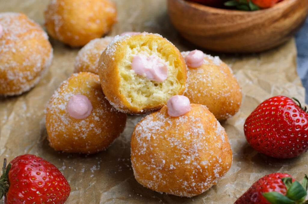 These Strawberry Cheesecake Donut Holes are fluffy fried cake donuts; rolled in sugar & stuffed with a creamy strawberry cheesecake filling. 