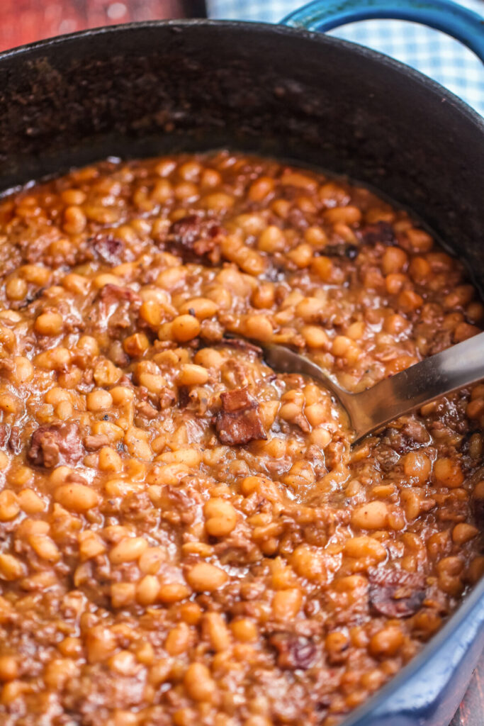 The BEST Homemade Cowboy baked beans recipe with step by step instructions for baking in the oven, in your crock pot, or over the campfire.