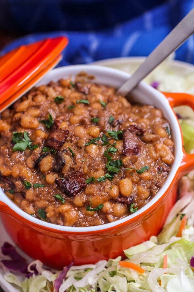 The BEST Homemade Cowboy baked beans recipe with step by step instructions for baking in the oven, in your crock pot, or over the campfire.