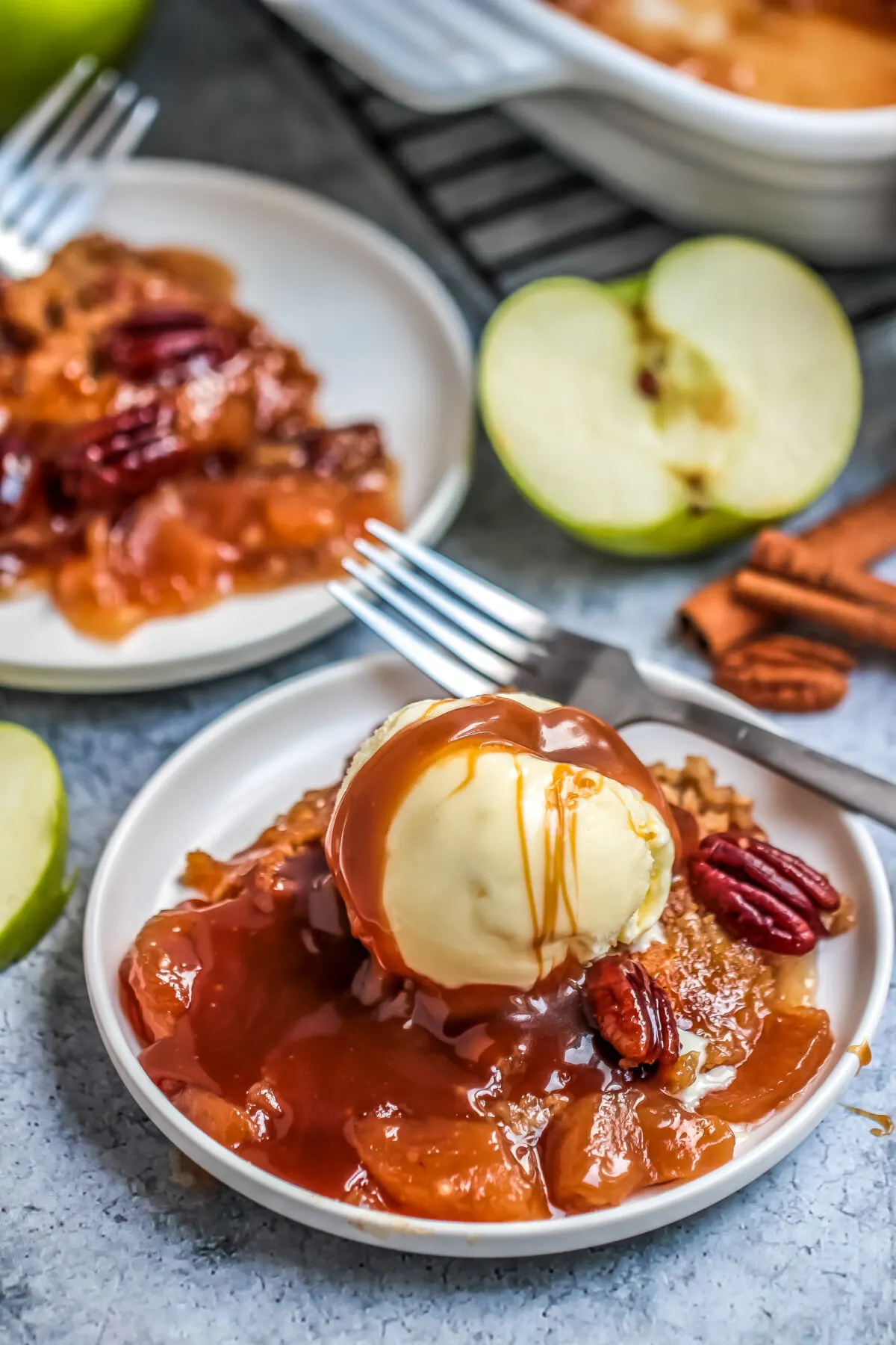 A delicious apple dump cake recipe that is easy to prepare and makes a great fall dessert served warm with ice cream and caramel sauce!
