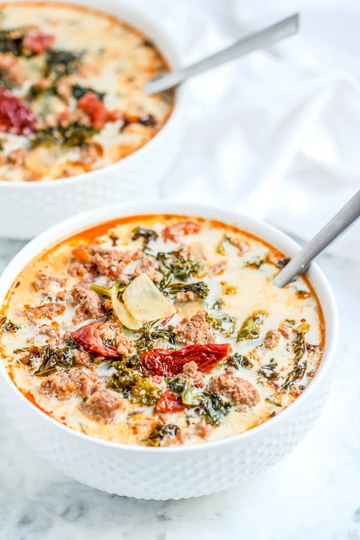 This Keto Tuscan soup recipe is a low carb take on the classic zuppa toscana. It's hearty, creamy, full of flavour and made in just one-pot!