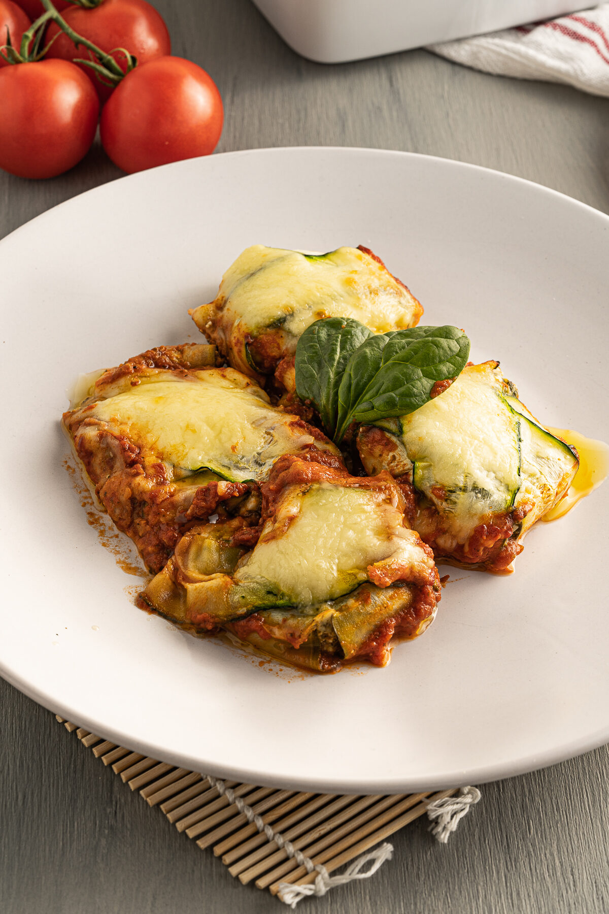 Zucchini ravioli is an easy to make Keto friendly family meal. Filled with cheese and spinach, it's a satisfying & tasty vegetarian dish!