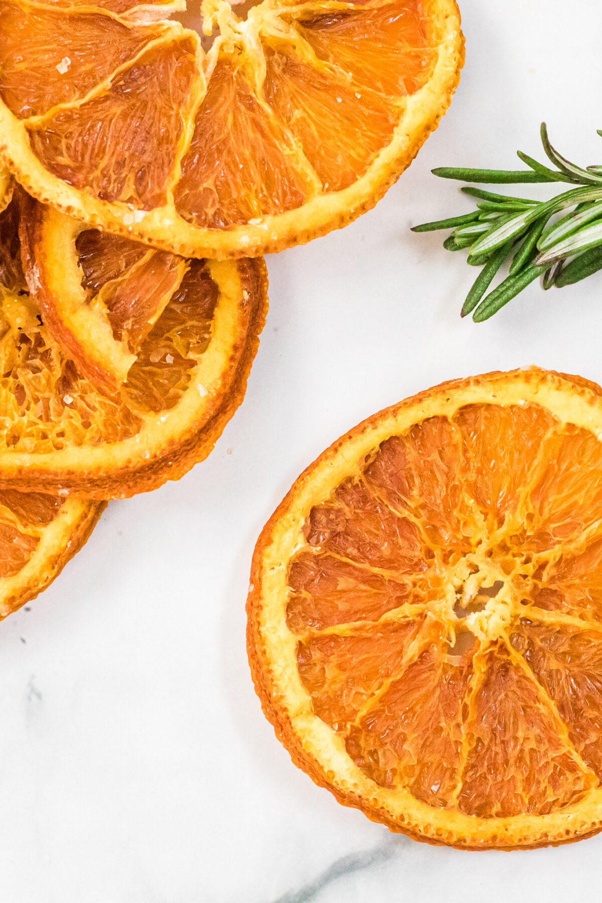 An excellent way to preserve oranges, dried orange slices can be used for craft projects, drink garnishes, or snacking.