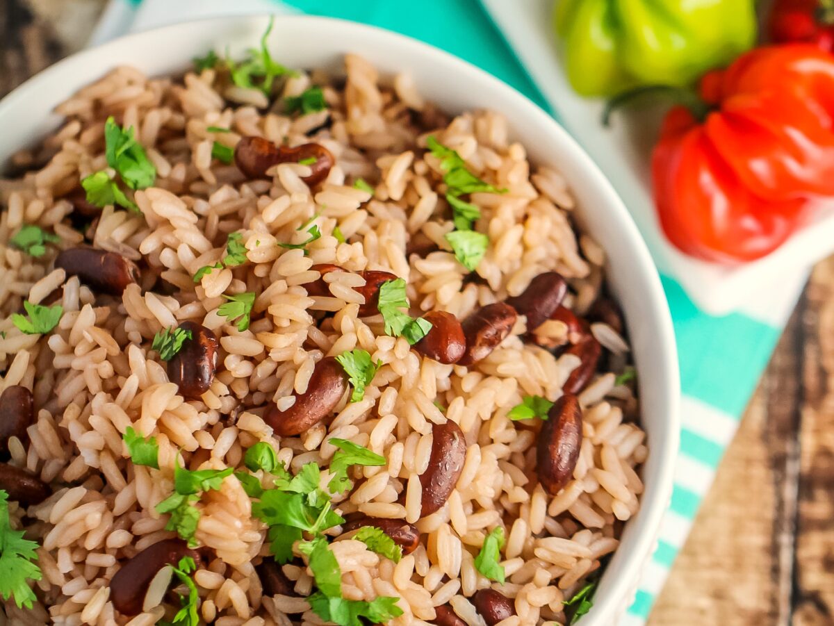 This Jamaican Rice and Peas recipe is an authentic recipe for the traditional Jamaican side dish featuring fragrant thyme and coconut milk! 
