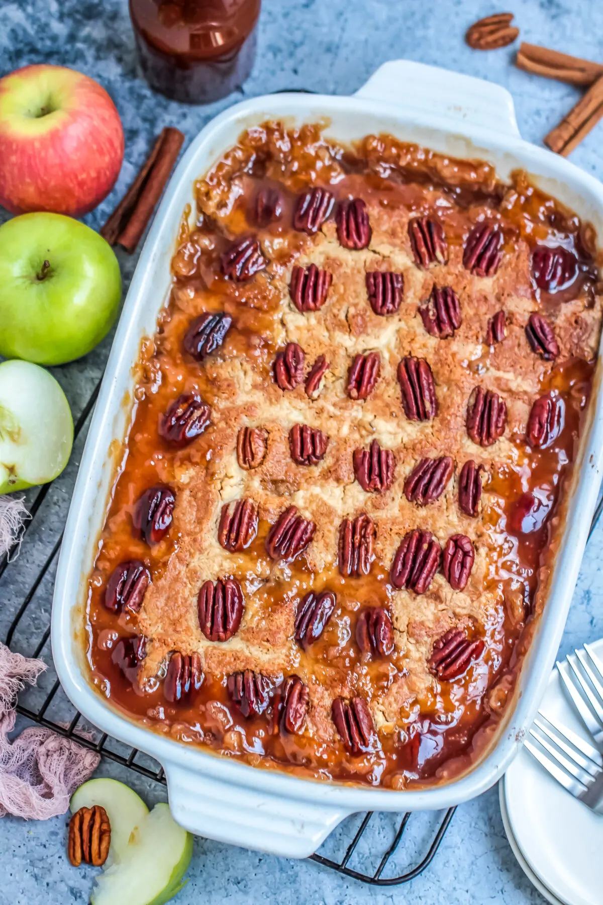 A delicious apple dump cake recipe that is easy to prepare and makes a great fall dessert served warm with ice cream and caramel sauce!