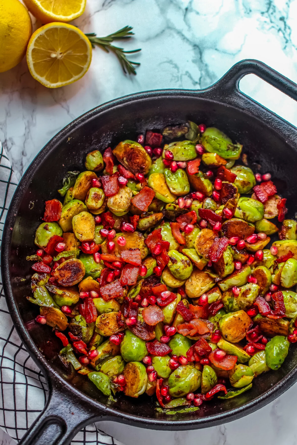 Pan Roasted Brussels Sprouts with Bacon & Pomegranate makes for a tasty holiday side dish that works just as easily for a weeknight side.