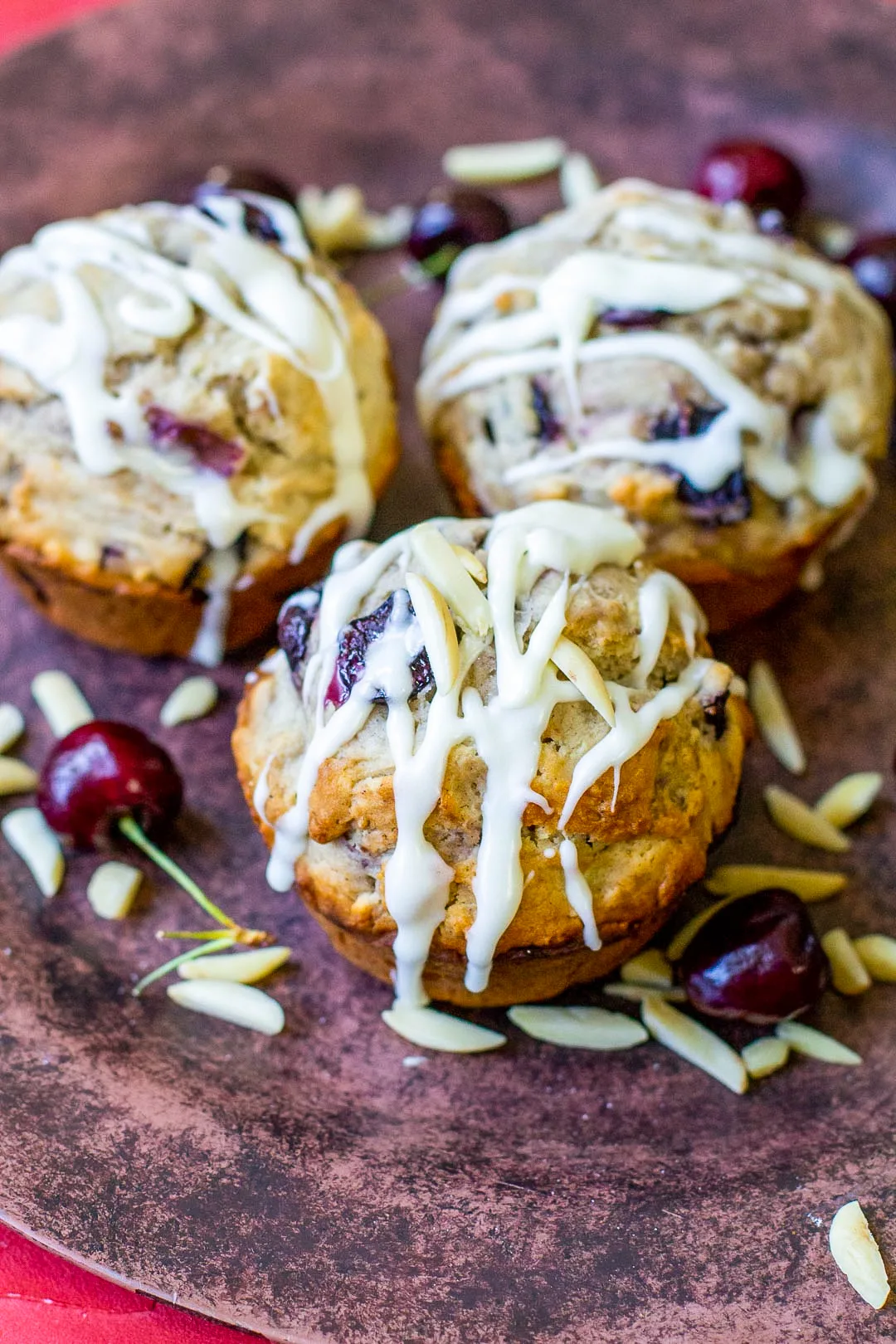 Easy and delicious cherry muffins made with fresh sweet cherries and a hint of almond.  Cherries are a wonderful addition to a basic muffin batter.