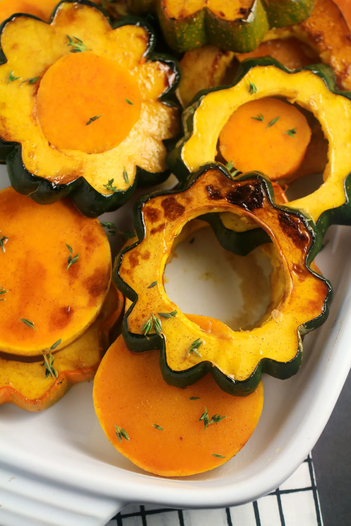 This Roasted Squash with Cranberry-Maple Glaze recipe makes for a perfect autumn side dish. A delicious Thanksgiving side dish!