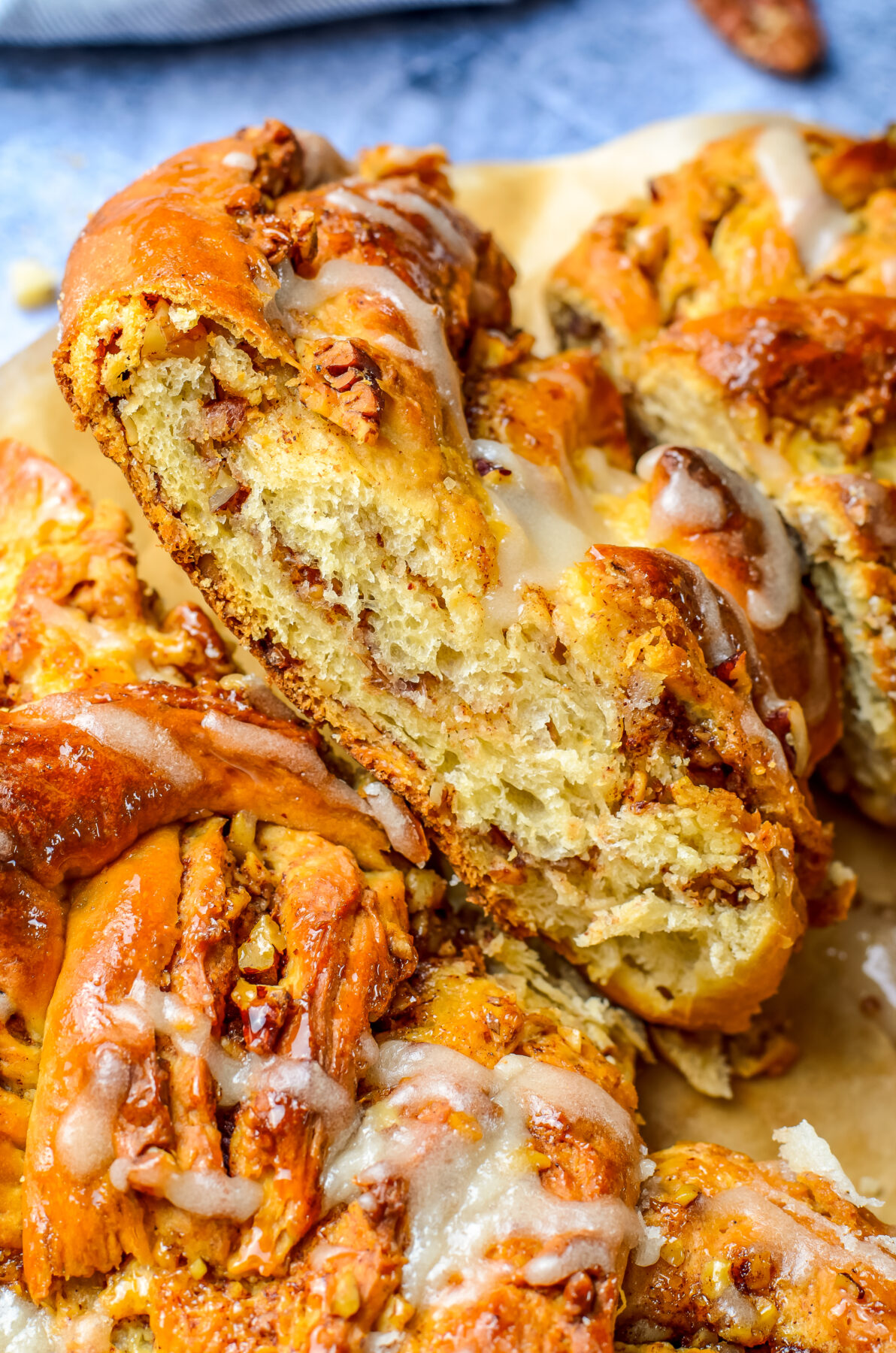 This Maple Pecan Wreath Bread is made up of soft and fluffy yeast dough with a cinnamon pecan filling, all topped with a sweet maple glaze.