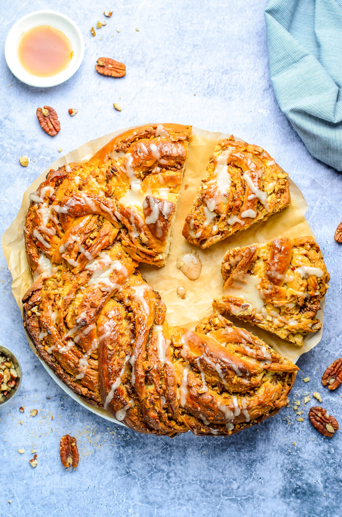 This Maple Pecan Wreath Bread is made up of soft and fluffy yeast dough with a cinnamon pecan filling, all topped with a sweet maple glaze.