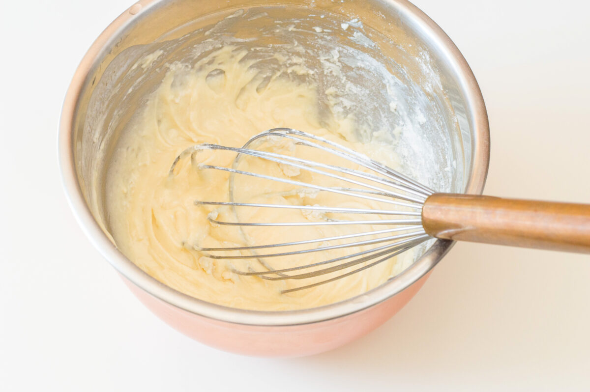 Mixing the batter for the cupcakes in a bowl