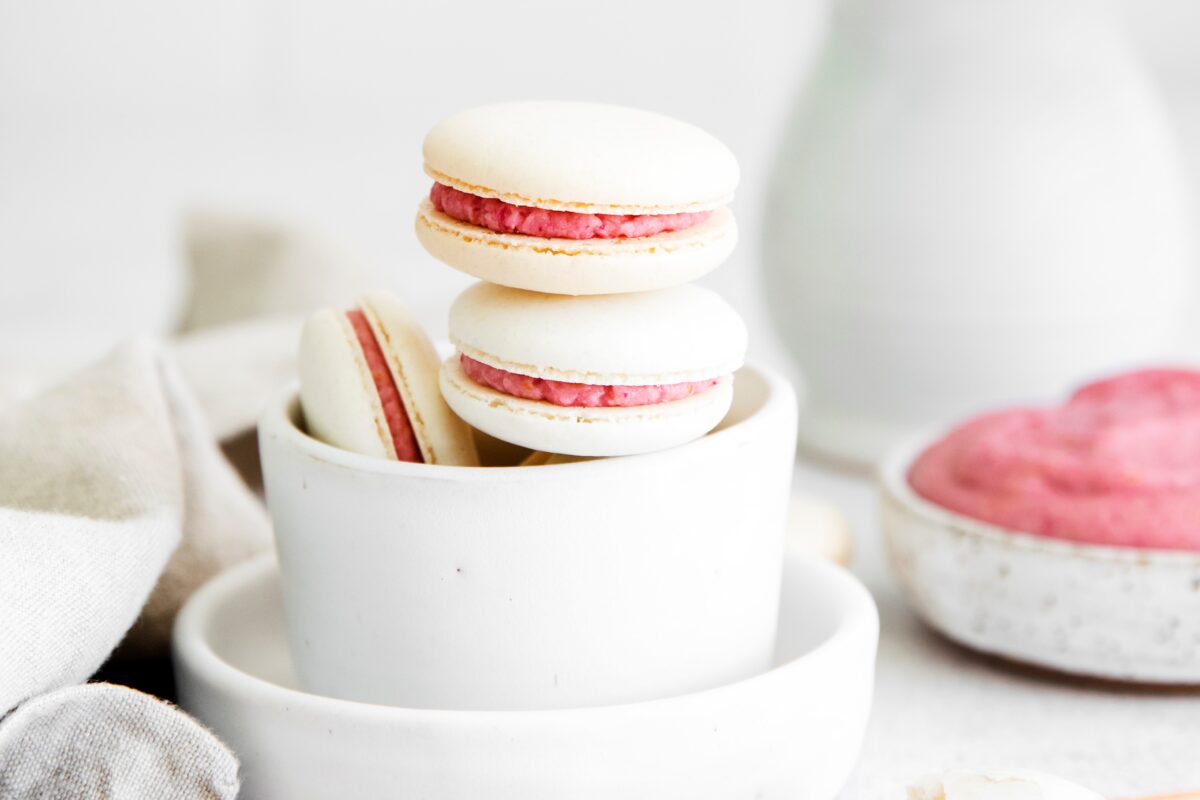 This Blood Orange Macarons recipe is sweet & chewy with a tangy citrus flavour; they're sure to be the star of the show at any holiday party.