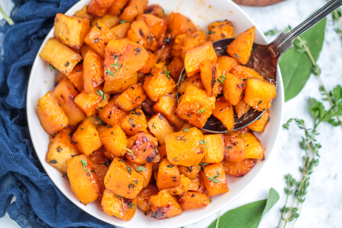 Roasted butternut squash with brown sugar and herbs is a tasty side dish for any fall menu. You will love this perfectly caramelized squash!