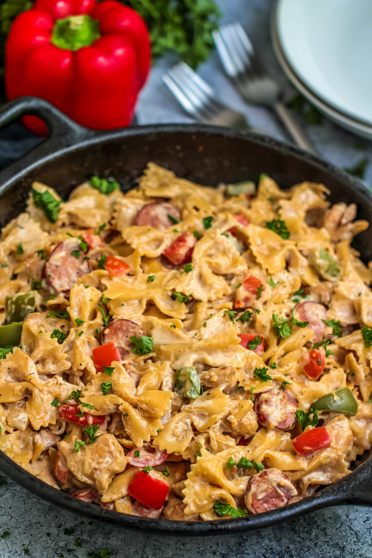 This Cajun Chicken Alfredo Pasta Recipe is a spicy take on a creamy classic. The best of both worlds in one easy dish with Andouille sausage!