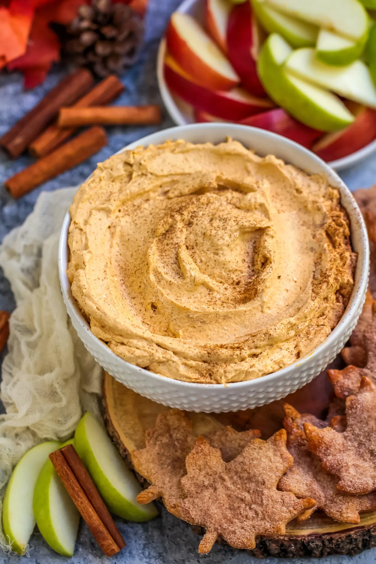 Pumpkin pie fluff dip that has all the flavours of a slice of pie. Served with cinnamon sugar pie crust chips, it's the perfect fall dessert!