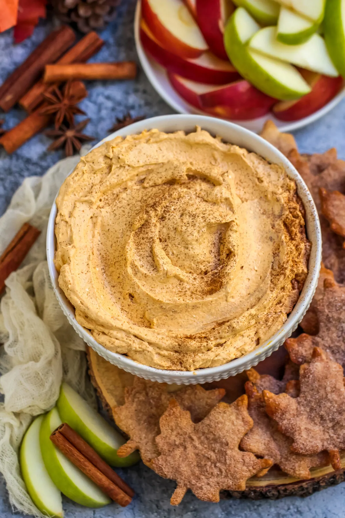 Pumpkin pie fluff dip that has all the flavours of a slice of pie. Served with cinnamon sugar pie crust chips, it's the perfect fall dessert!