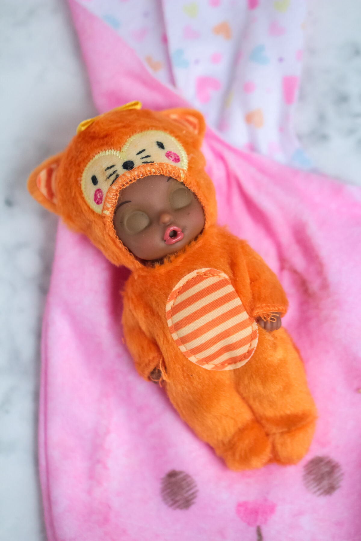 Baby Born Surprise Animal Babies are collectible baby dolls wearing soft and cozy themed onesies that come hidden inside a soft bunny pouch.