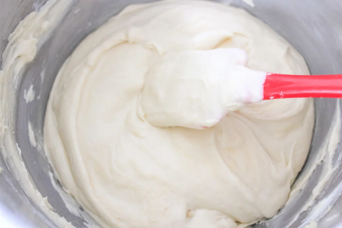 Mixing cupcake batter in a large bowl.