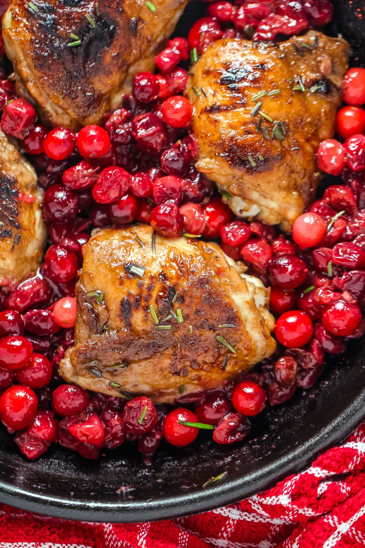 This Cranberry Roasted Chicken recipe is easy to make plus it's a one pan dinner that is oh so deliciously festive and seasonal.