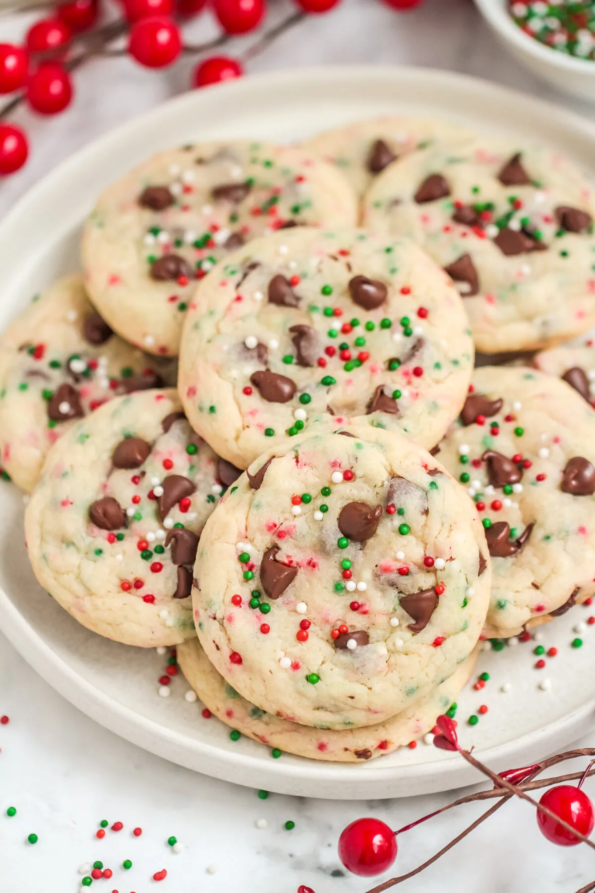 You'll love this easy recipe for Christmas Chocolate Chip Cake Mix Cookies! Only a few ingredients are needed to make soft festive cookies.