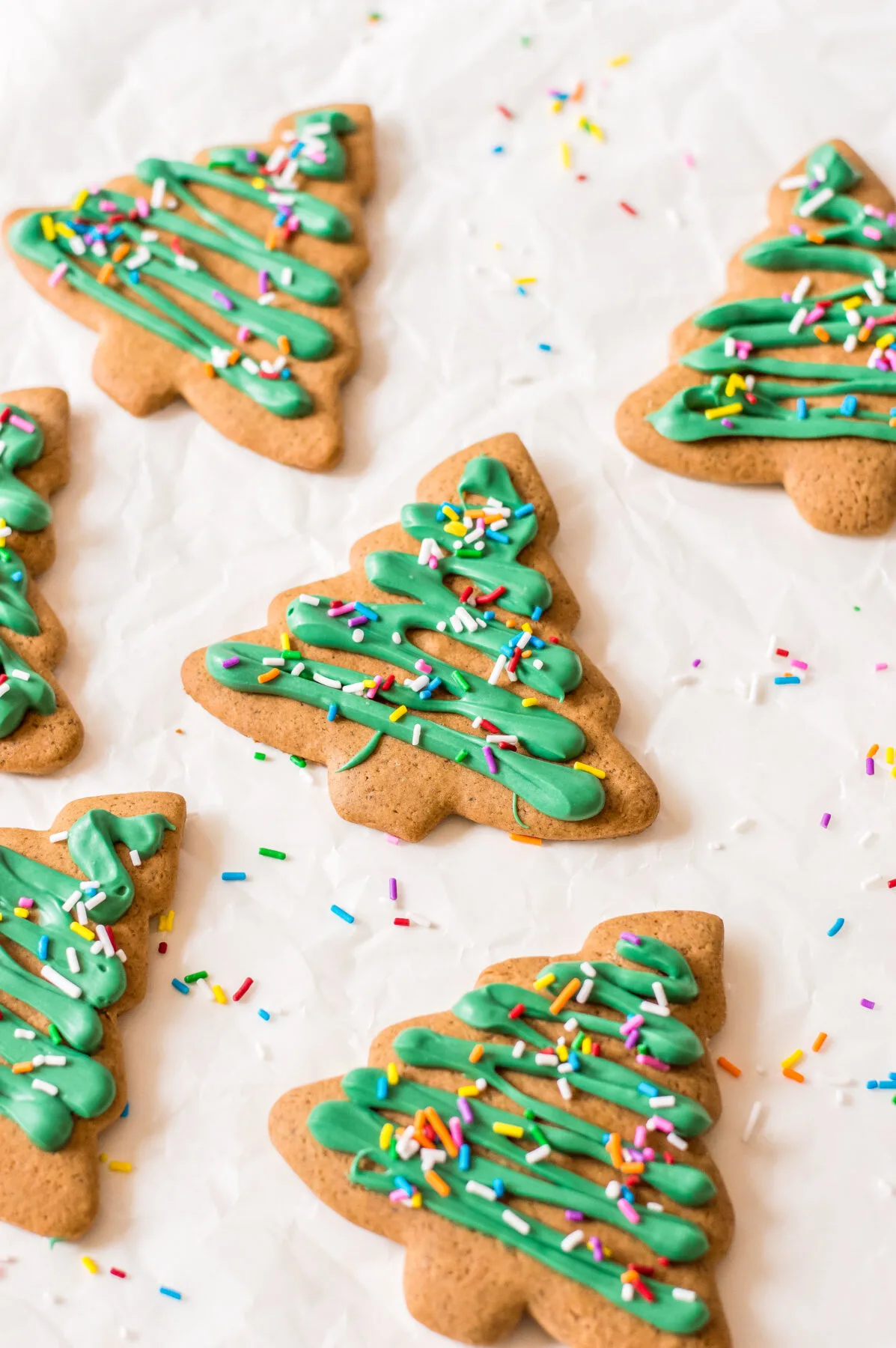 These gingerbread Christmas tree cookies are fun to make with your family. They're festive, delicious, and perfect for any holiday party!