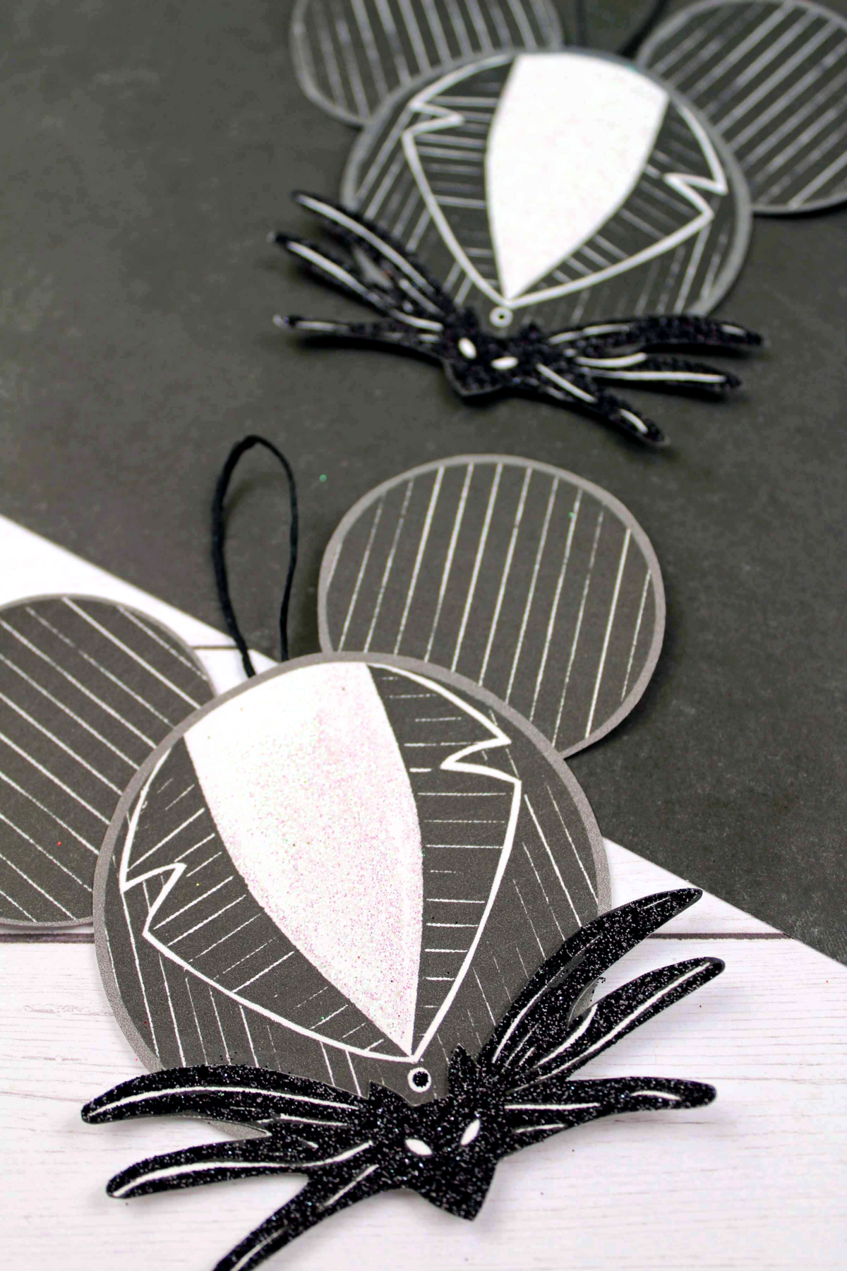 Make your own Jack Skellington Suit Mickey Ears Christmas ornament with this easy to follow tutorial. Free printable template included!