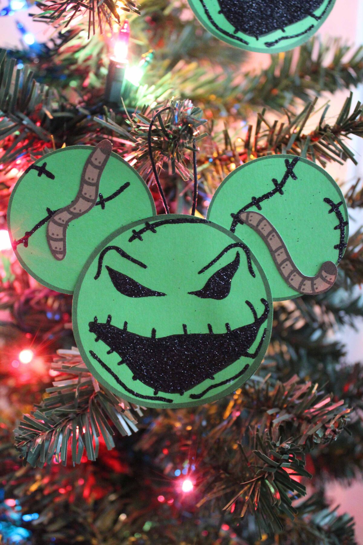 Make this easy DIY Oogie Boogie Mickey Ears Ornament as part of your Disney inspired Christmas tree decorations. Free printable template!