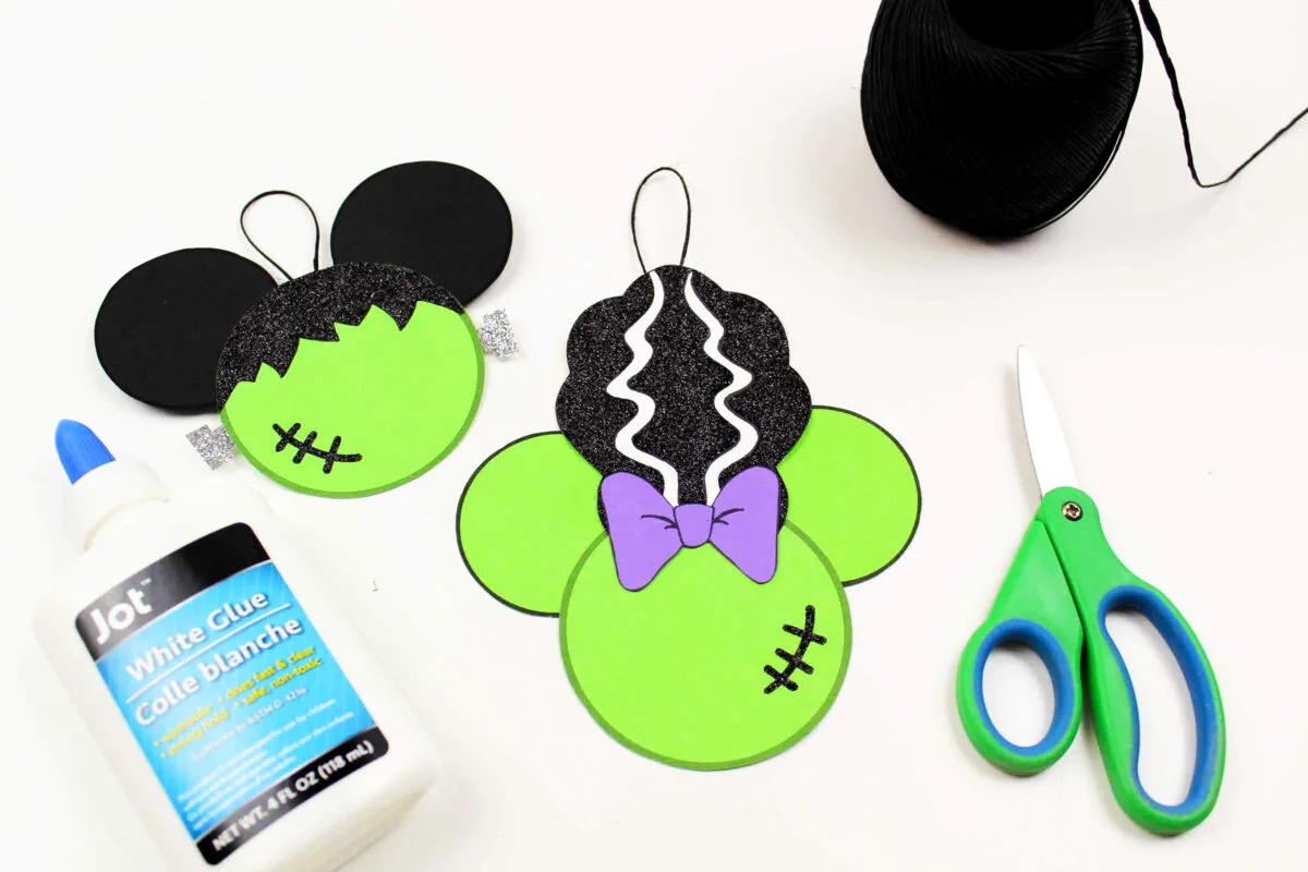 Gluing the loops onto the backs of the frankenstein mickey heads.
