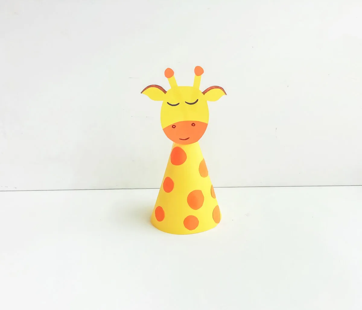 Giraffe head glued onto the cone.