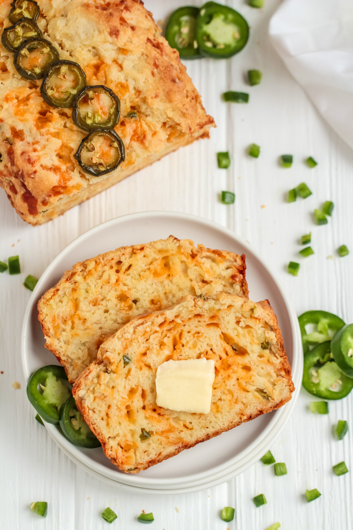This easy jalapeño cheddar bread recipe is loaded with spice & cheese. It's a great savoury quick bread with a moist, tender crumb.