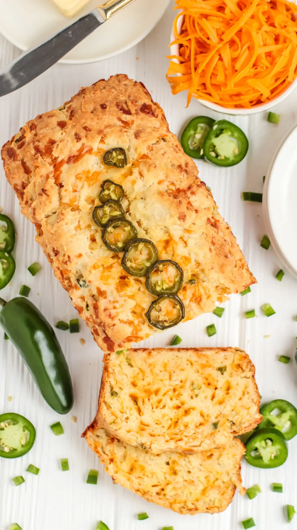This easy jalapeño cheddar bread recipe is loaded with spice & cheese. It's a great savoury quick bread with a moist, tender crumb.