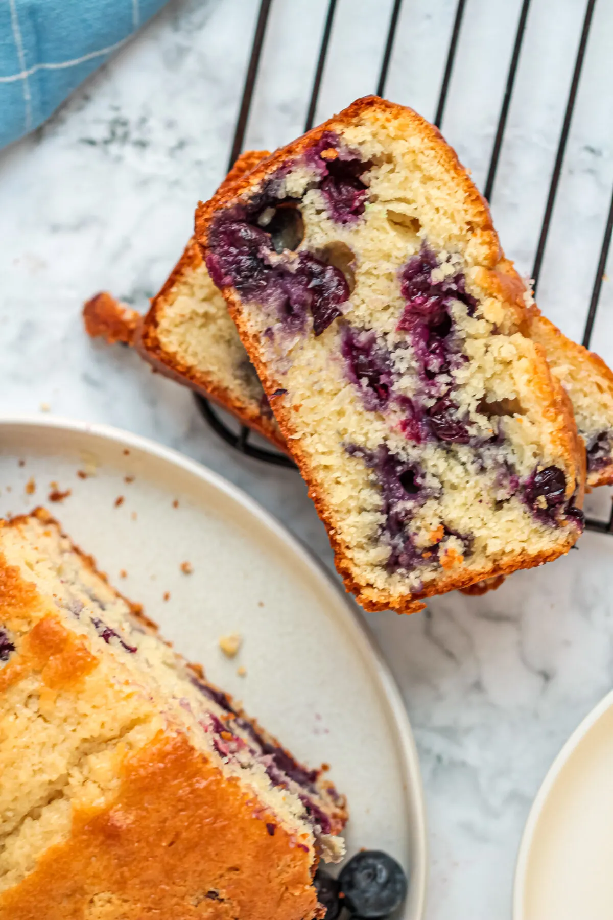 This Blueberry Muffin Bread is a favourite blueberry bread recipe in our family that is moist, fluffy and packed full of juicy blueberries.