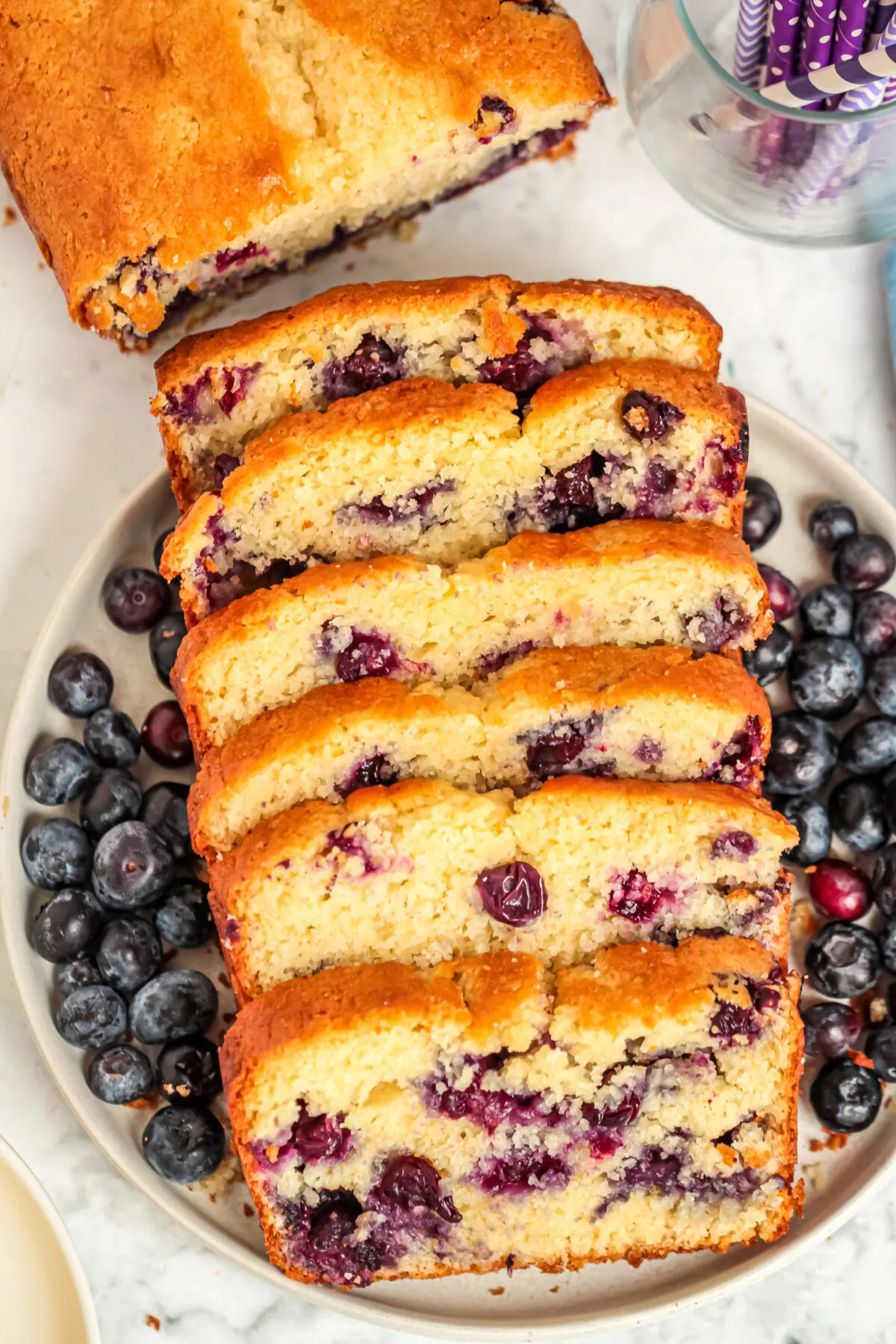 This Blueberry Muffin Bread is a favourite blueberry bread recipe in our family that is moist, fluffy and packed full of juicy blueberries.