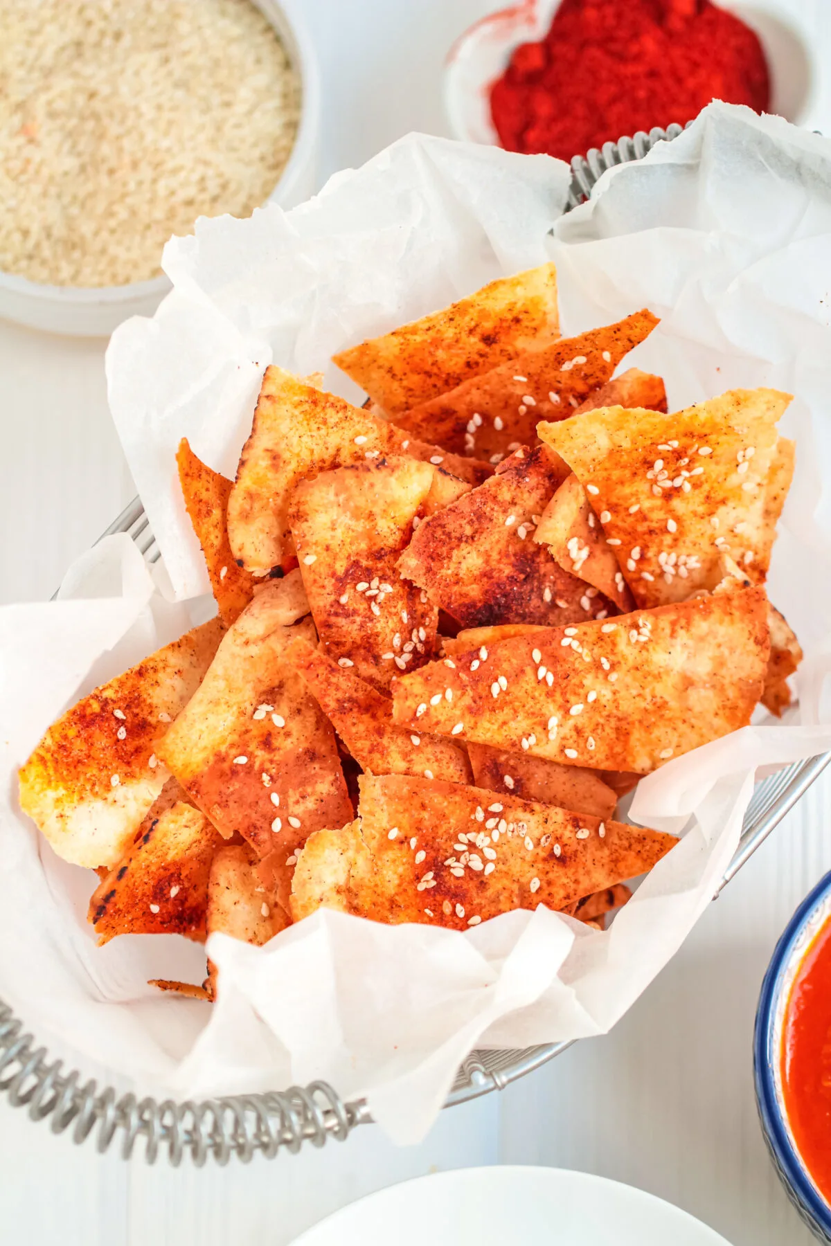 Looking for a delicious and easy pita chip recipe? Look no further than these homemade smoked paprika pita chips with sesame seeds!