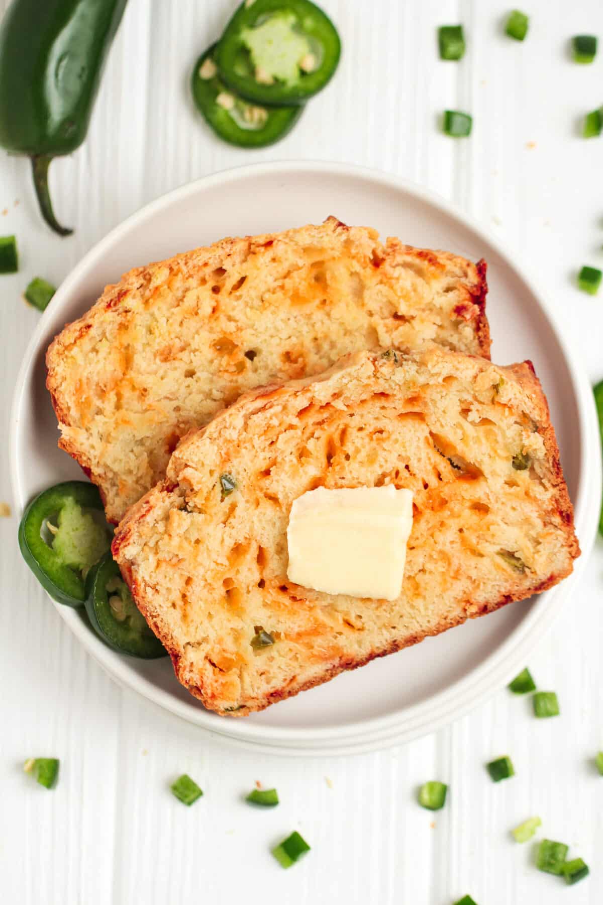 This easy jalapeño cheddar bread recipe is loaded with spice & cheese. It's a great savoury quick bread with a moist, tender crumb.
