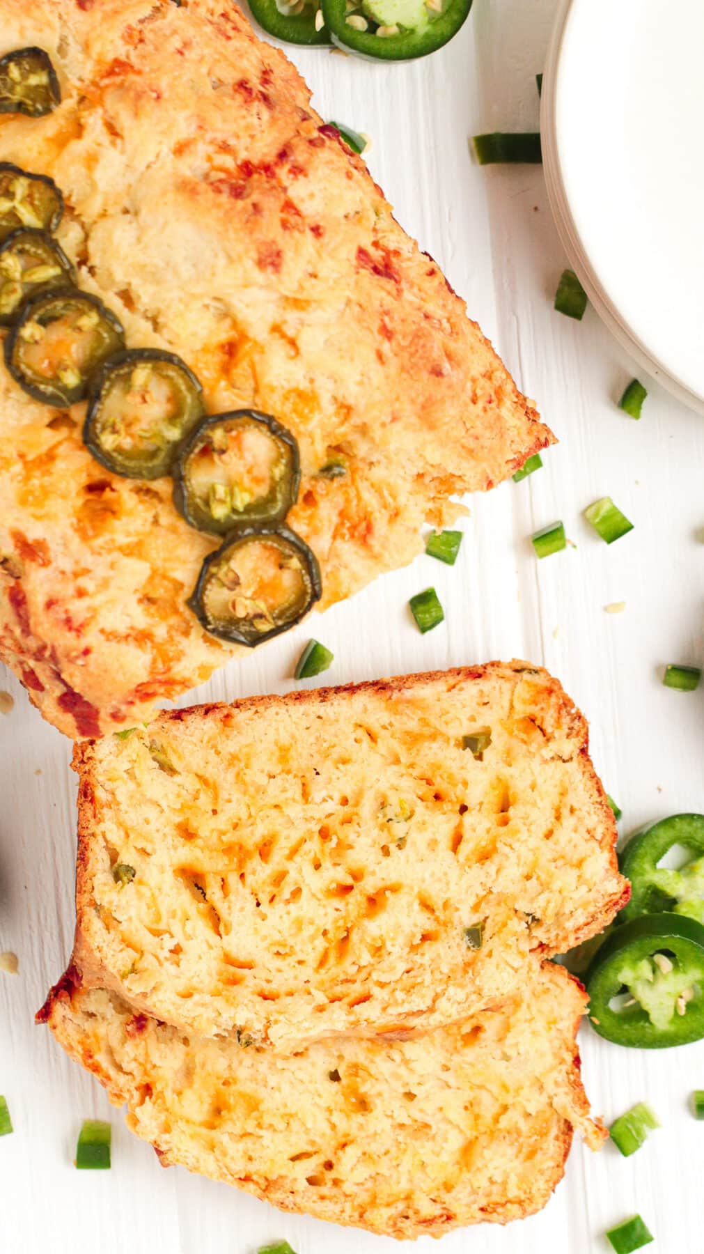This easy jalapeño cheddar bread recipe is loaded with spice & cheese. It's a great savoury quick bread with a moist, tender crumb.