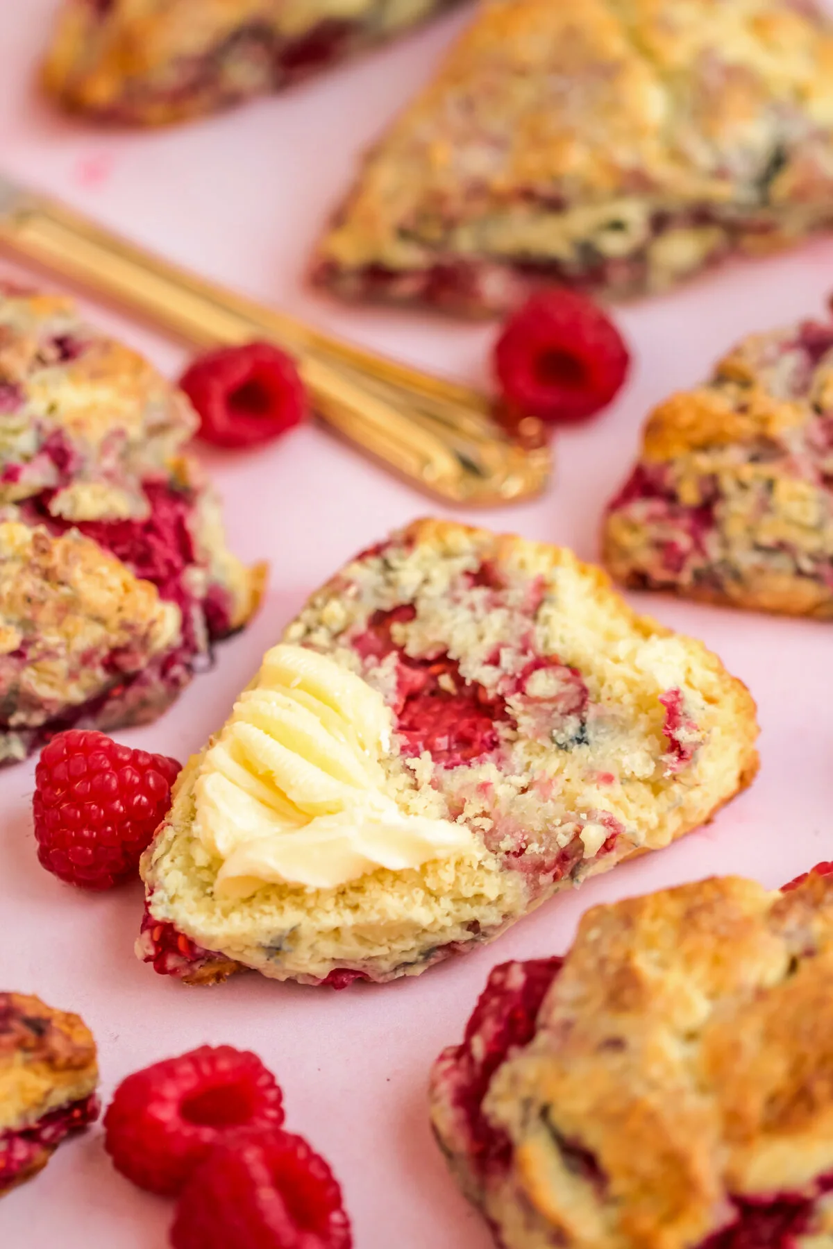 This scrumptious recipe for raspberry scones results in homemade scones that are light and fluffy with a crisp crust and tart raspberries!