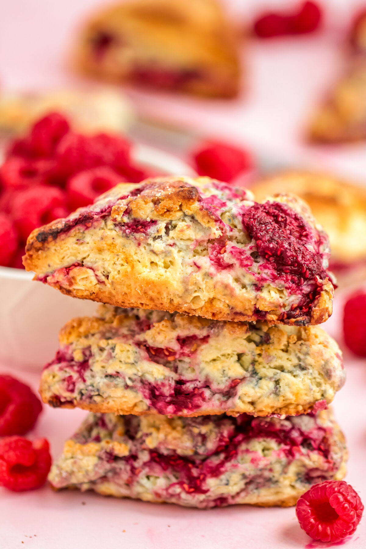 This scrumptious recipe for raspberry scones results in homemade scones that are light and fluffy with a crisp crust and tart raspberries!