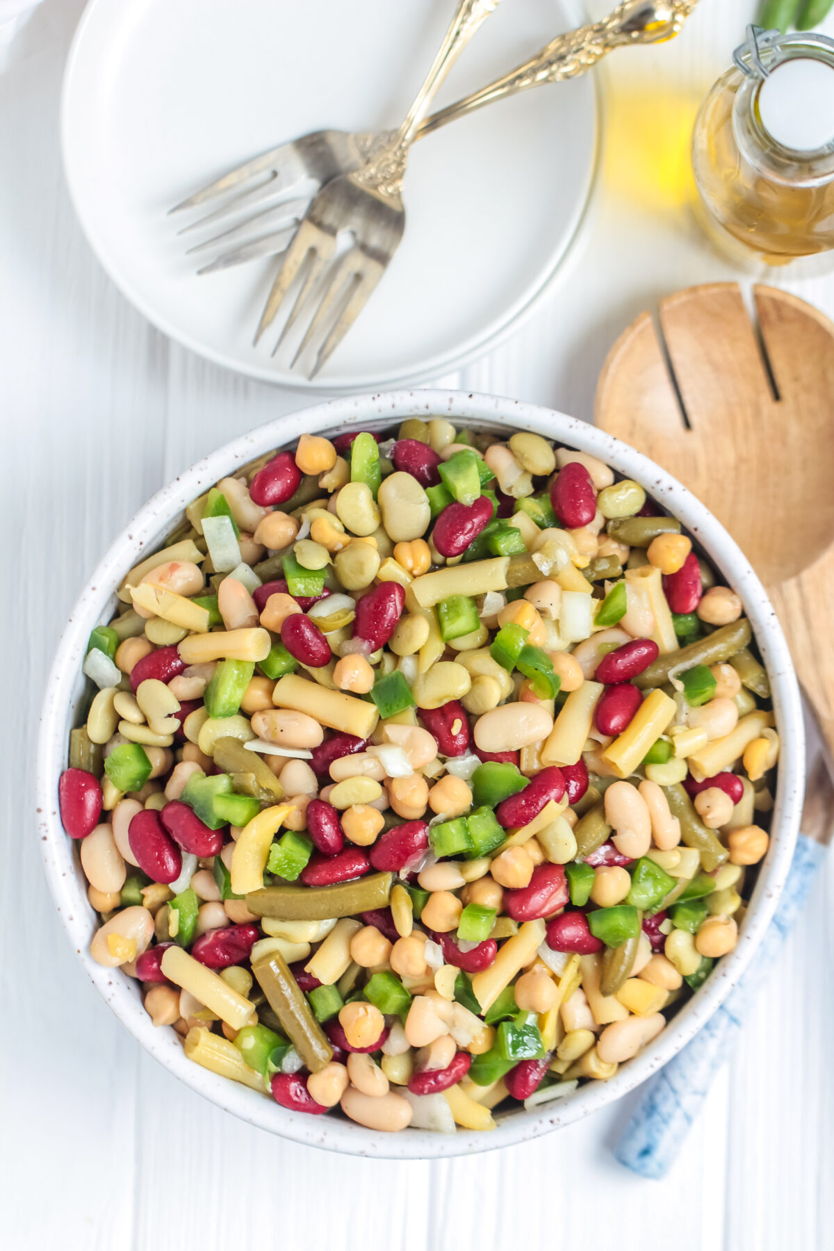 This is the BEST 5 bean salad recipe for potlucks, BBQs, and picnics! It's quick, easy, and affordable - a perfect salad for any budget.