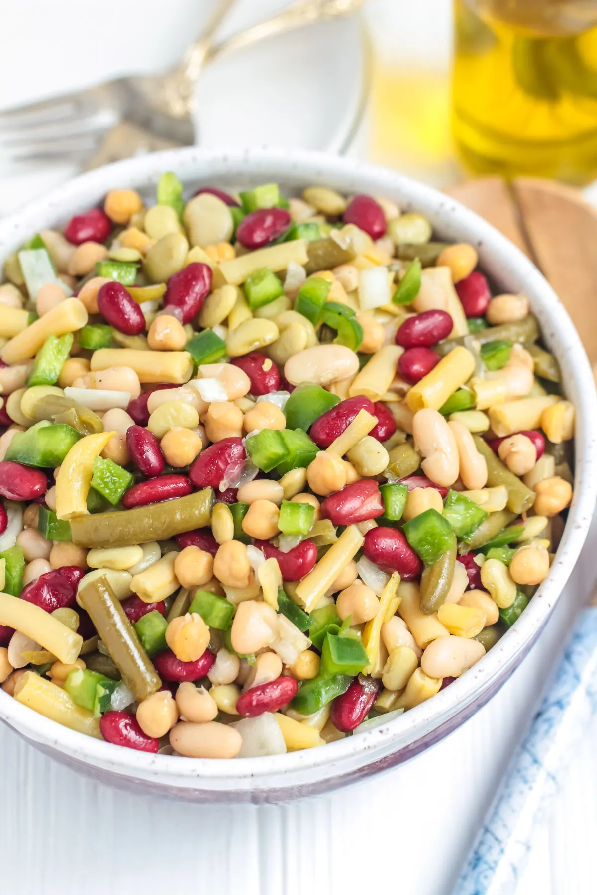This is the BEST 5 bean salad recipe for potlucks, BBQs, and picnics! It's quick, easy, and affordable - a perfect salad for any budget.