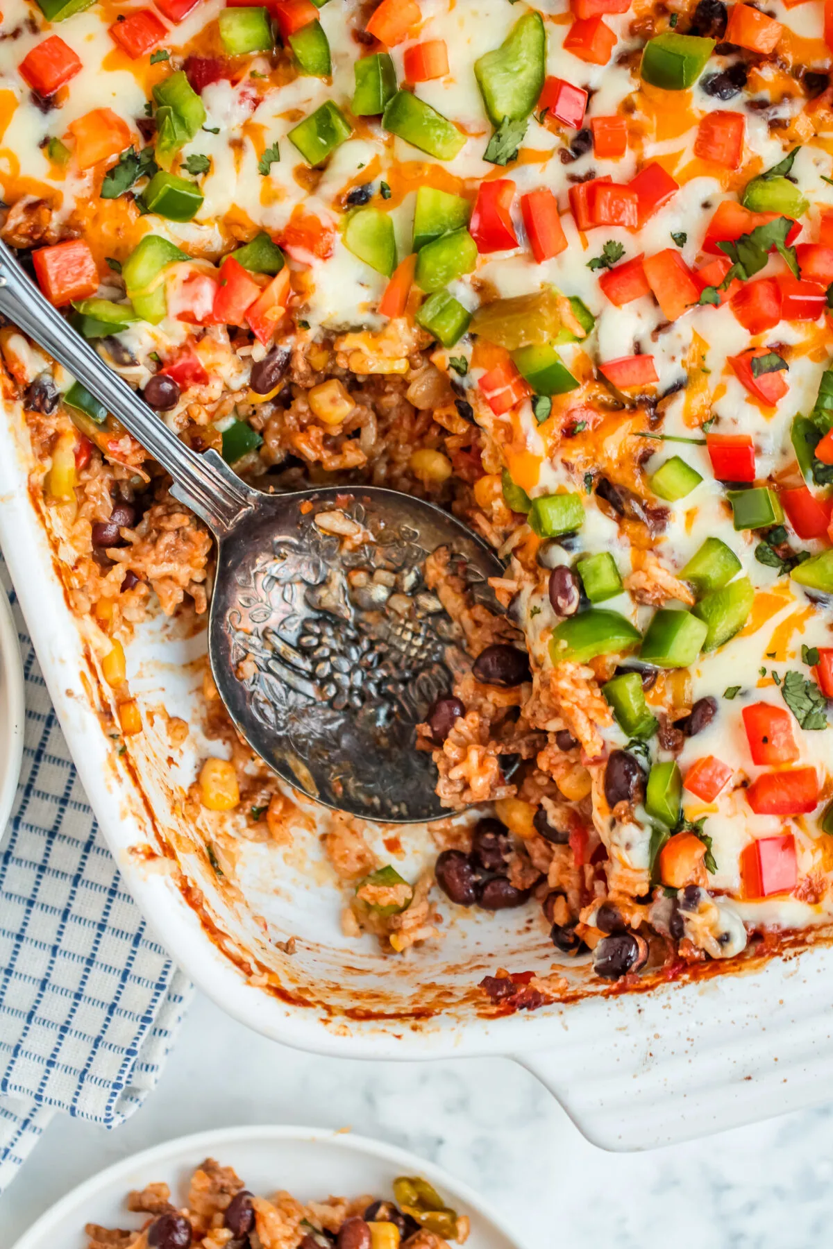 This easy Mexican ground beef casserole recipe is perfect for a weeknight meal! It's a hearty, comforting, and delicious casserole.